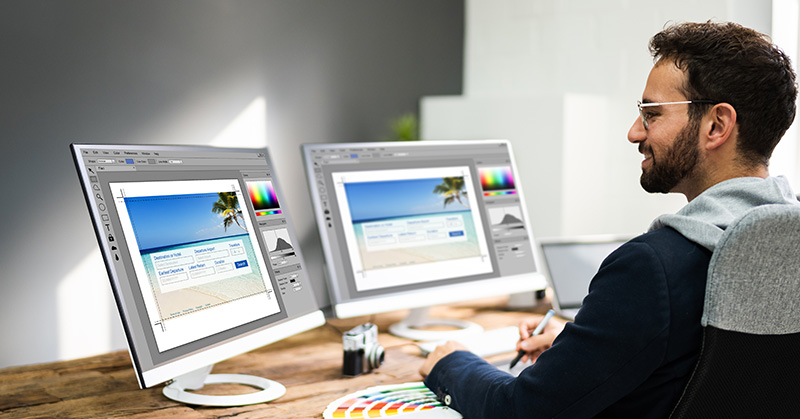 Man sitting at computer designing content